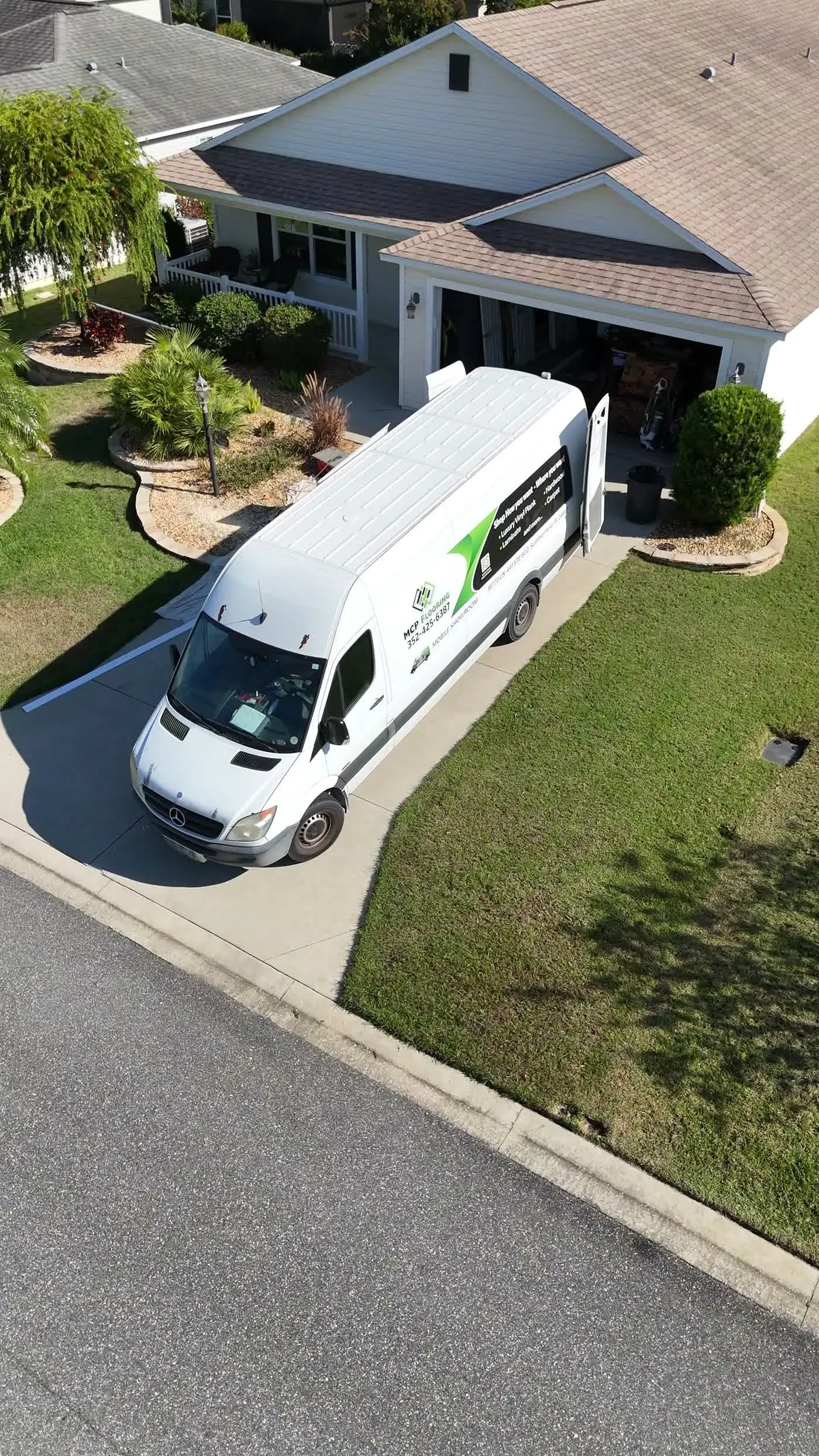 The MCP Flooring van parked at a home in a 55+ community near Summerfield, FL