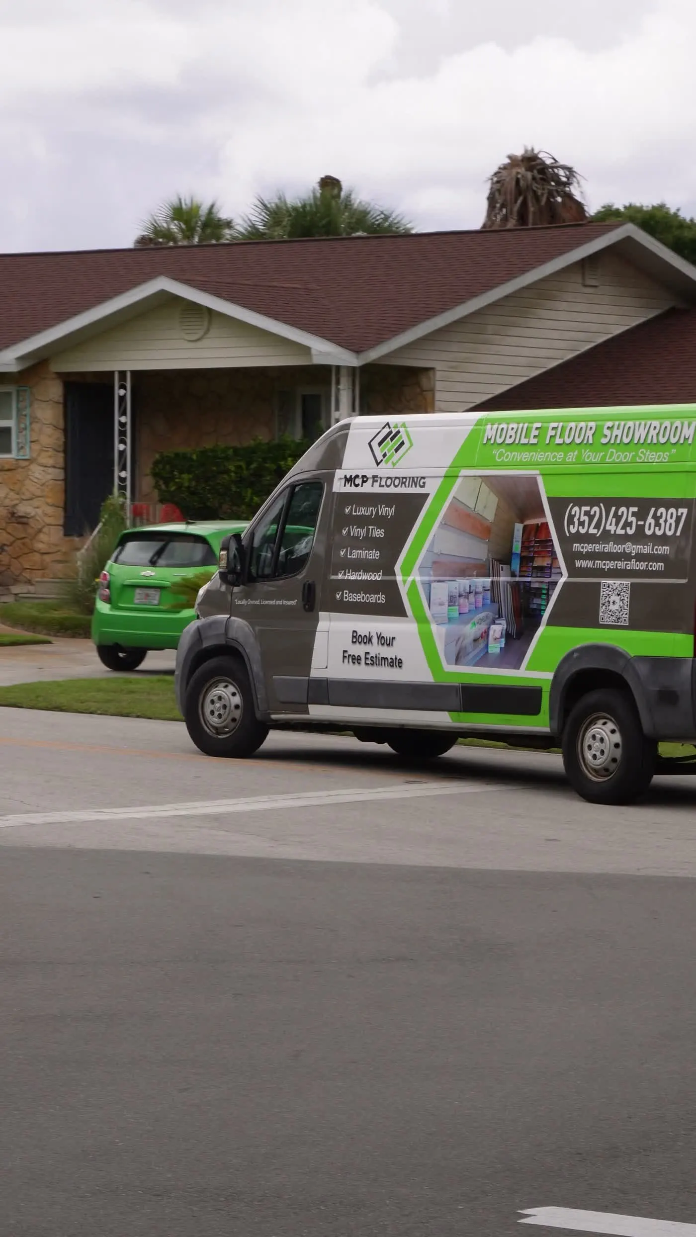 The MCP Flooring van parked at a customer's home for a free in-home flooring estimate