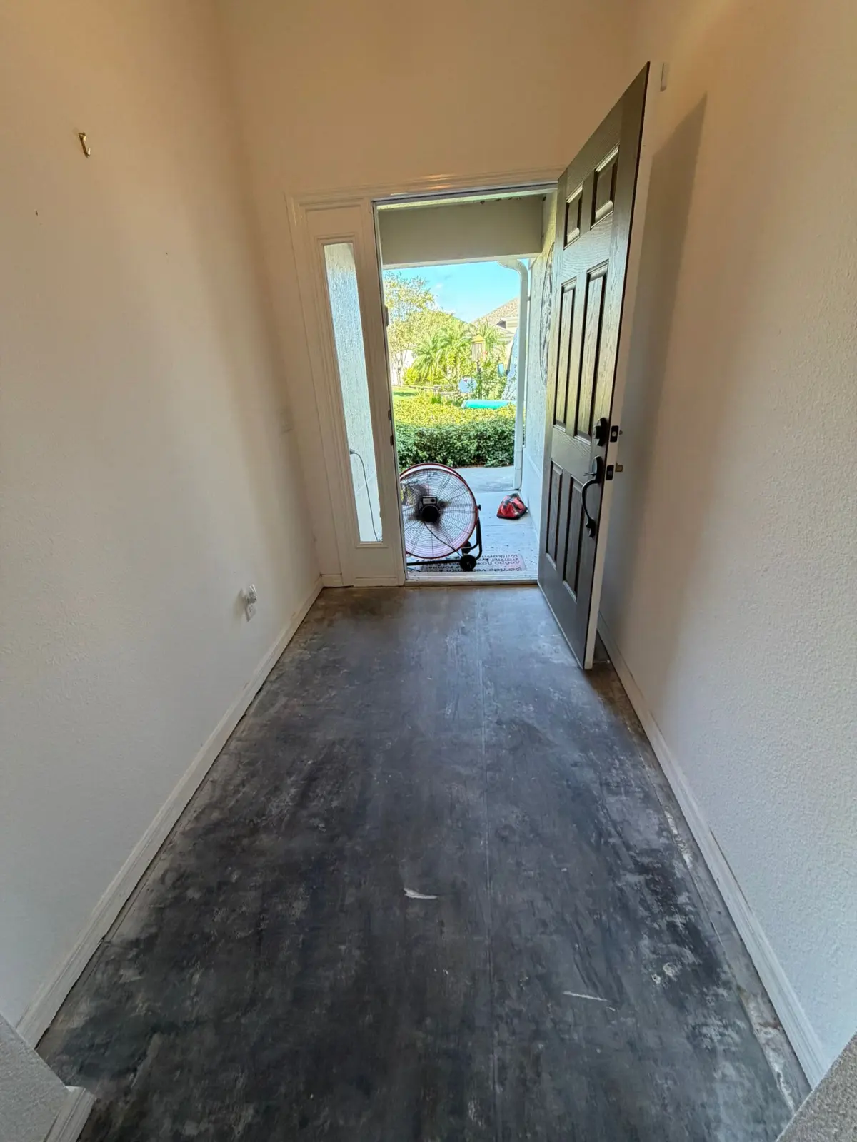 Hallway in dark gray wood-look plank in a Summerfield, FL home