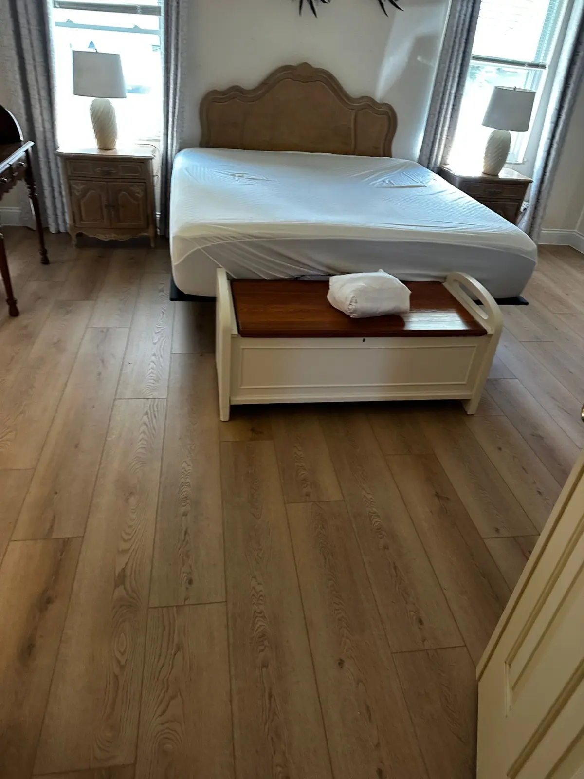 Bedroom with light oak-look luxury vinyl plank in a Summerfield, FL home