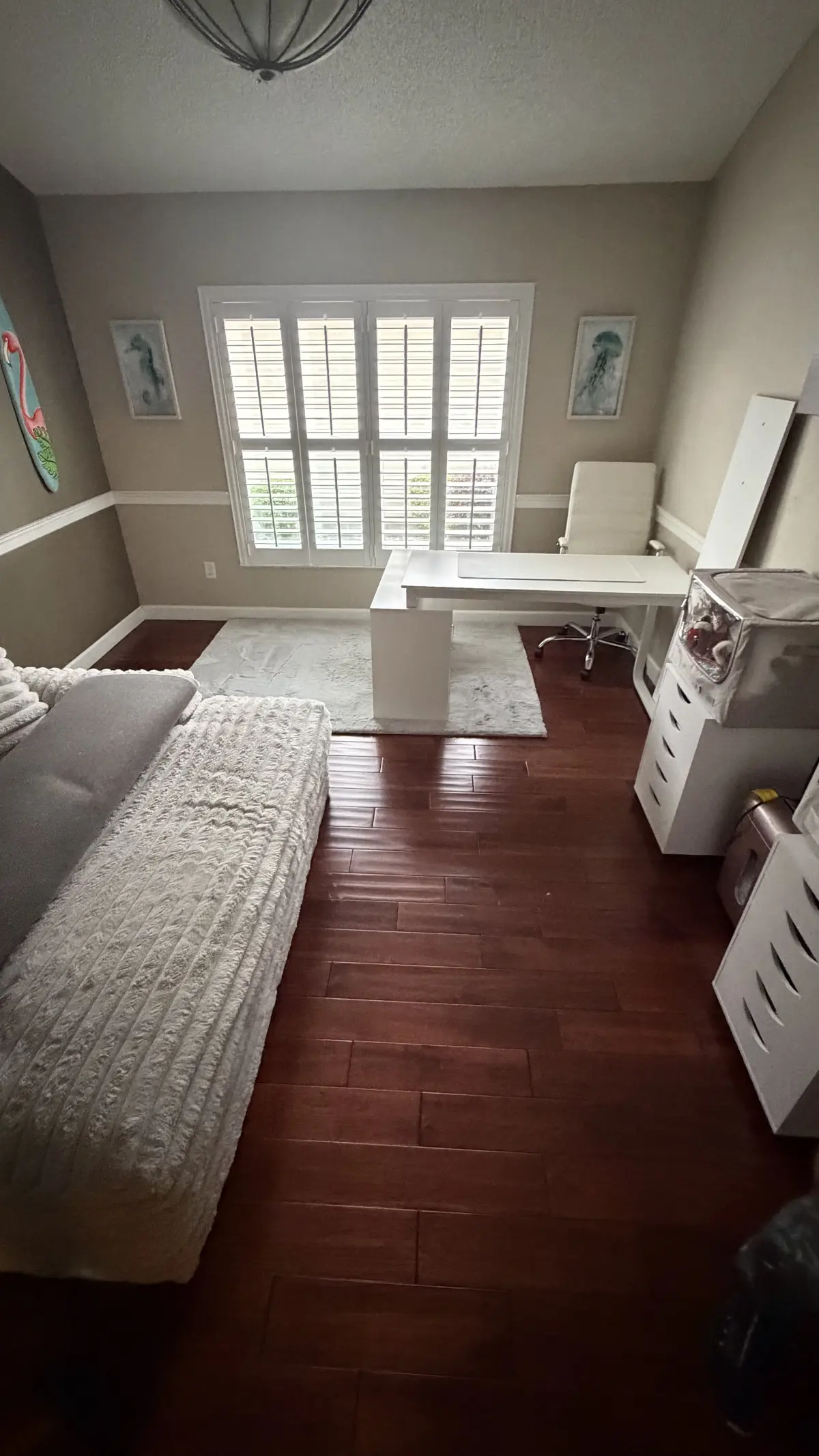 Kitchen and living area in dark cherry-toned flooring in a Summerfield, FL home
