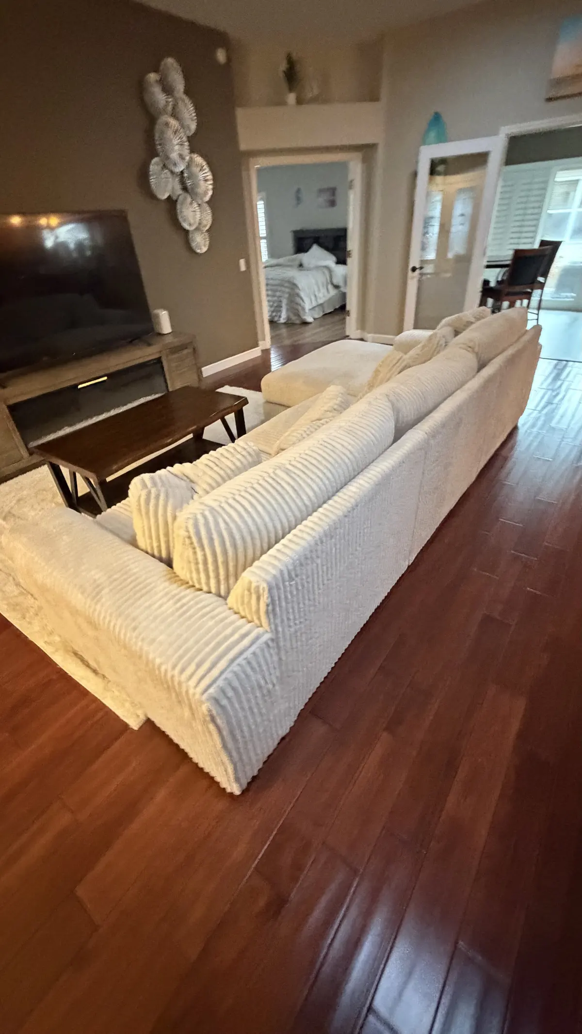 Furnished living room in warm wood flooring in a Summerfield, FL home