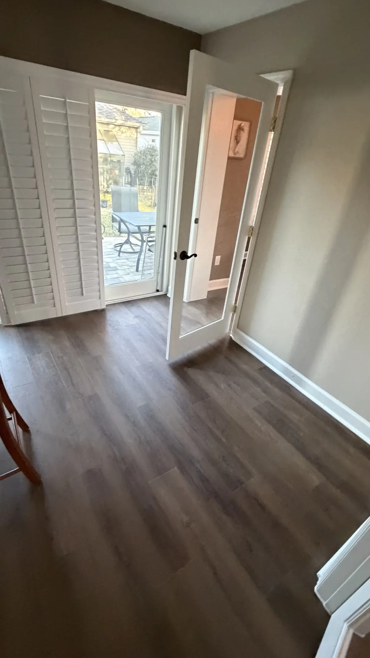 Entry and hallway in wood-look luxury vinyl plank in a Summerfield, FL home