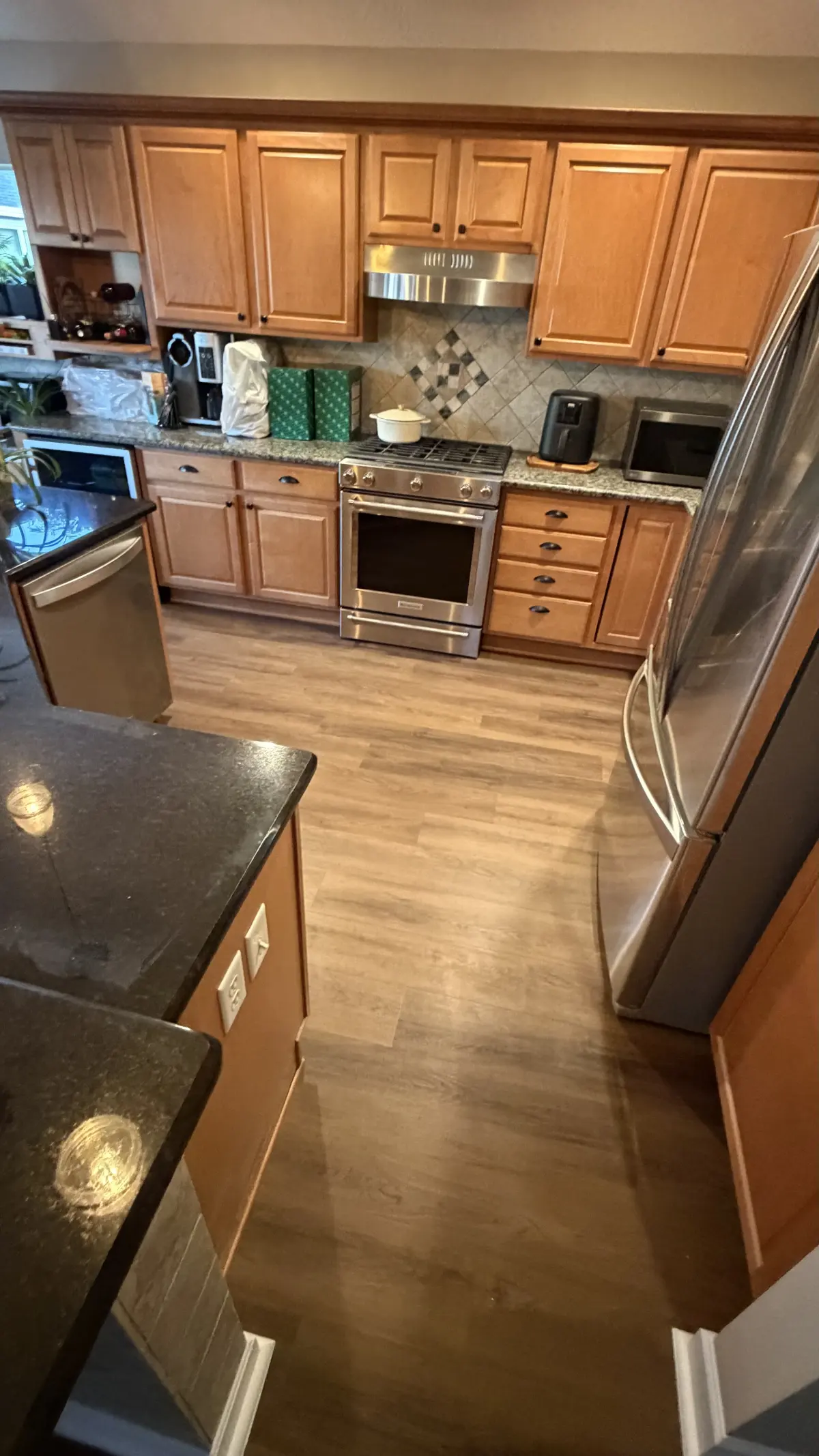 Kitchen finished in wood-look luxury vinyl plank in a Summerfield, FL home