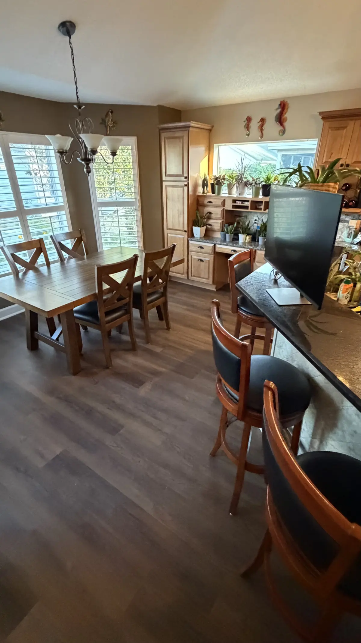 Luxury vinyl plank running through the living and dining area of a villa in The Villages, FL