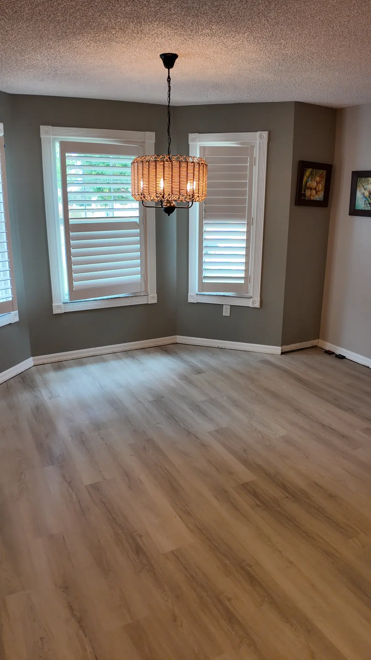 Dining area in light wood-look luxury vinyl plank in a Summerfield, FL home