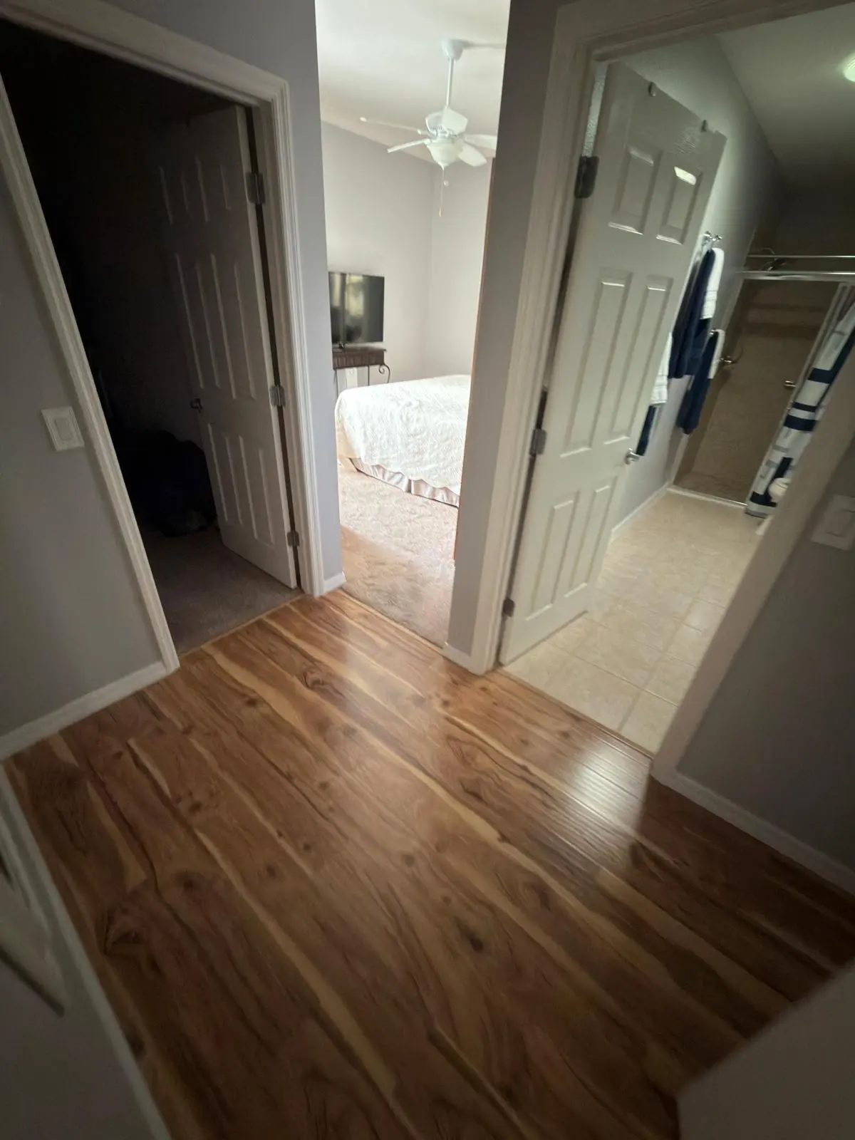 Wood-look laminate floor down the guest hallway of a Lady Lake, FL home