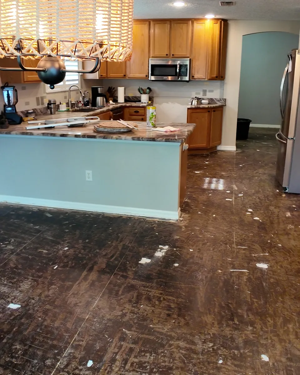 The kitchen in The Villages after the old floor was taken up, before the new floor