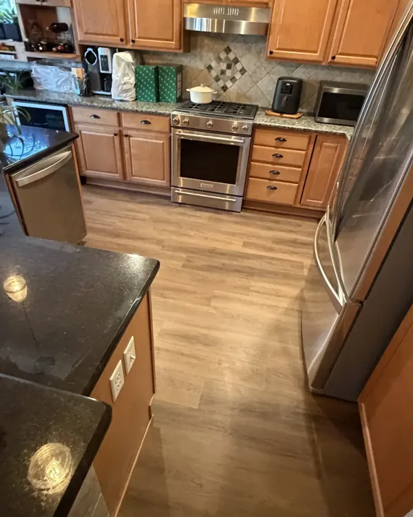 Kitchen finished in wood-look luxury vinyl plank